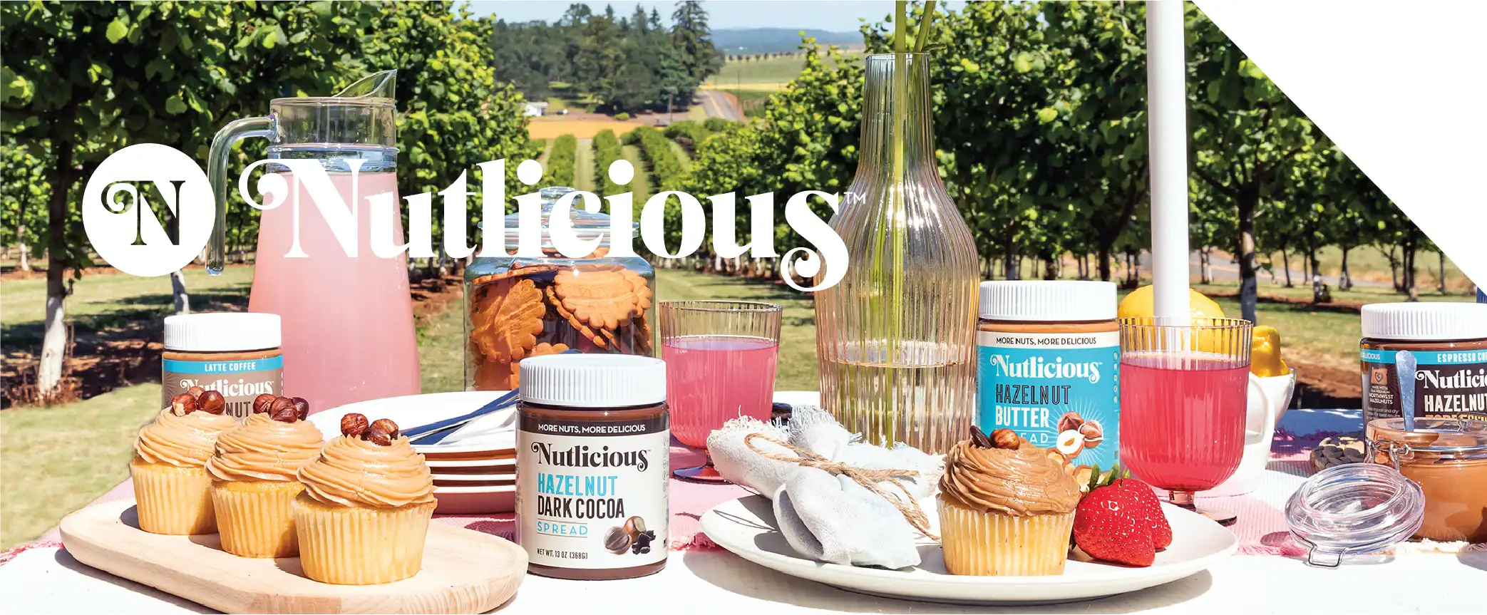 Nutlicious Hero Graphic showing the four original flavors on a table with other food items